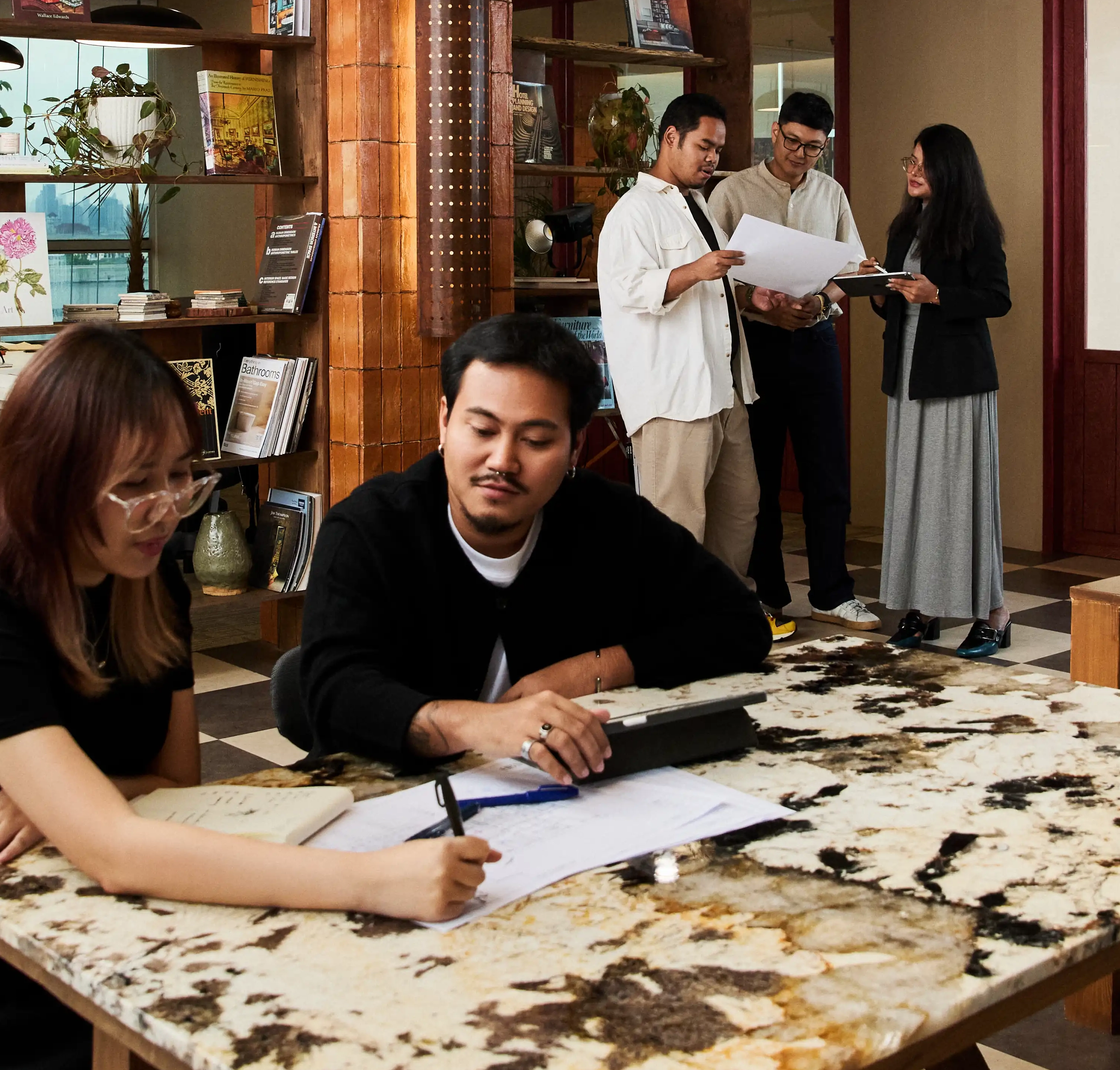 Architect drafting plans on marble table