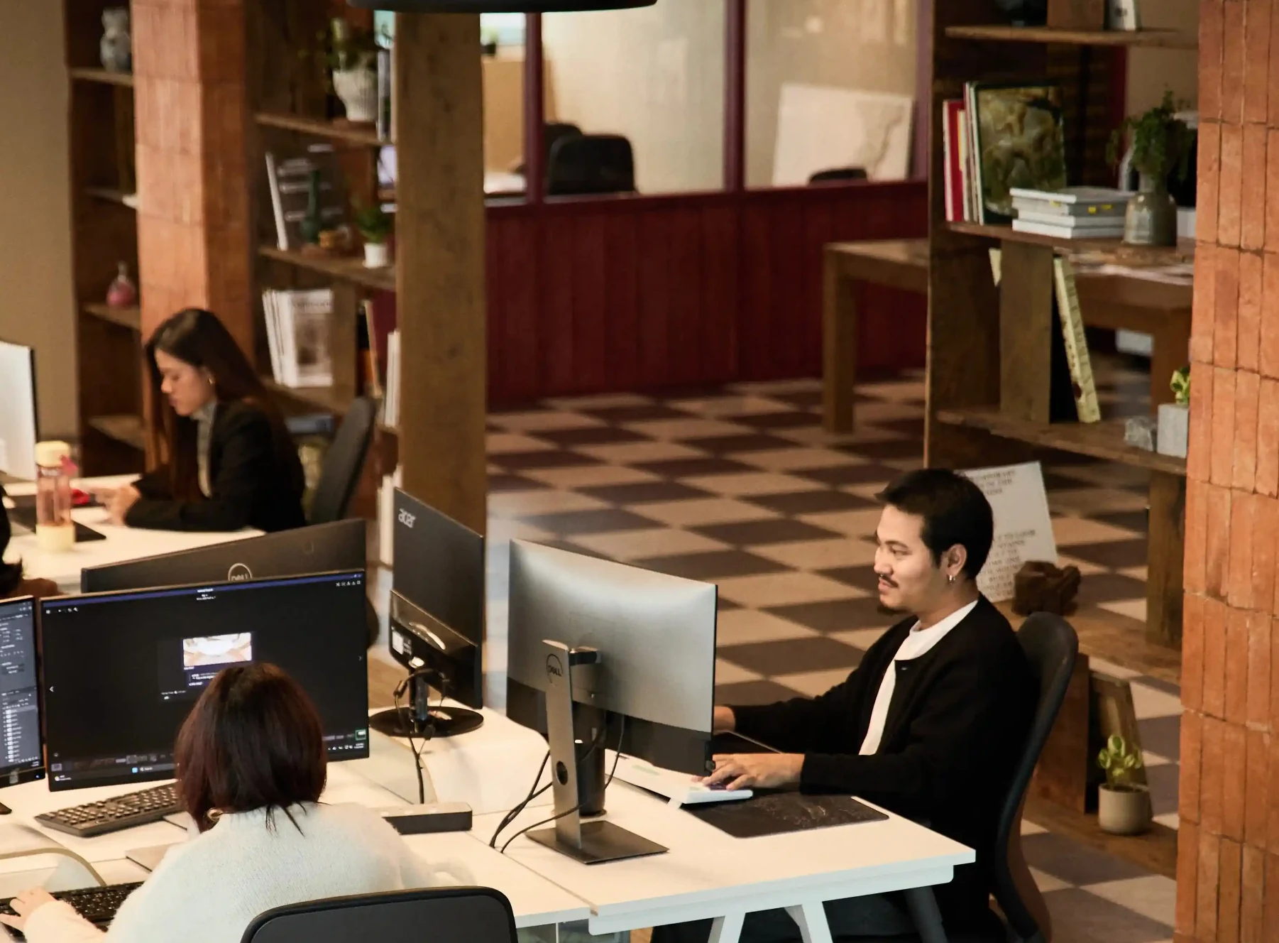 Designer working at workstation desk
