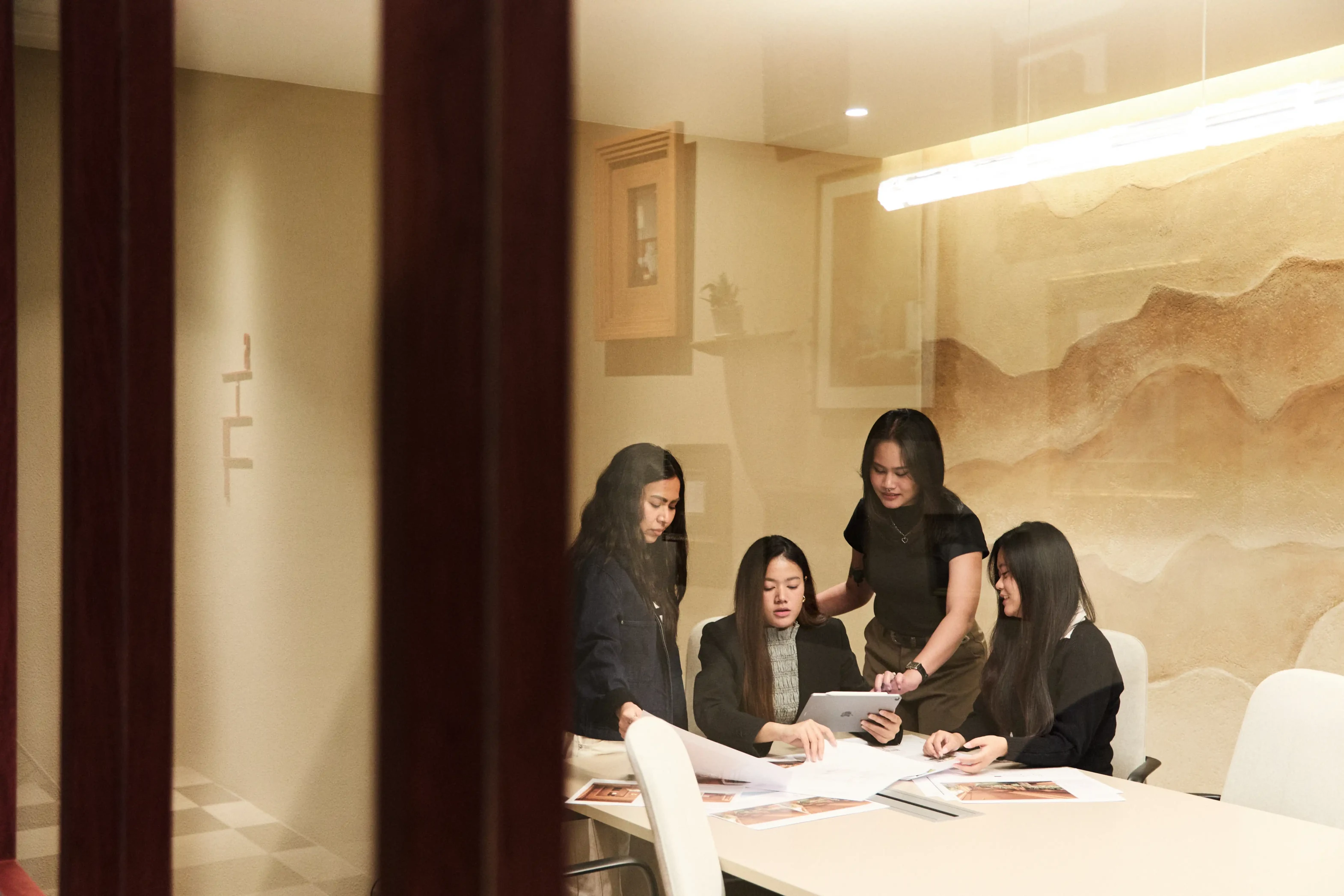 Team meeting around table in conference room