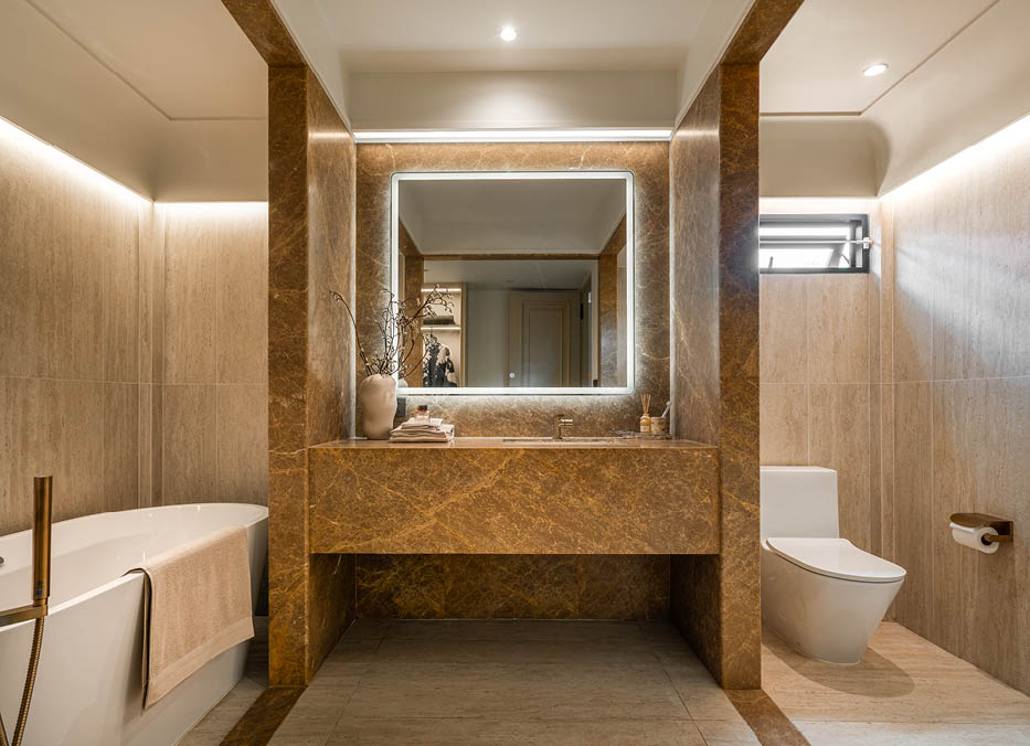 MASTER BATHROOM — AMBER MARBLE & BRASS FITTINGS