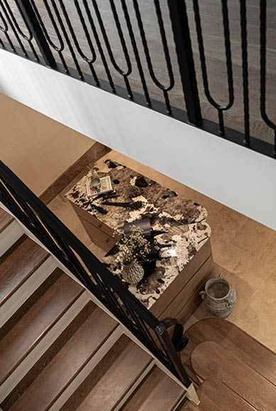 Staircase with forged iron balustrade