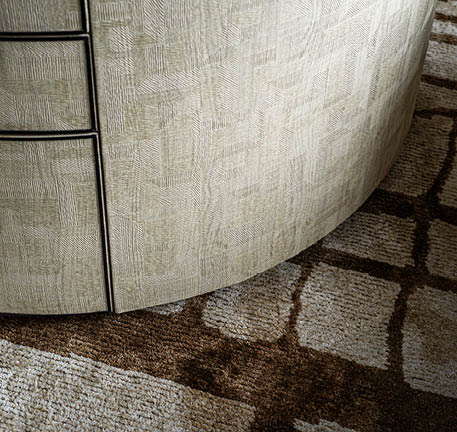 Parquetry dresser and woven rug detail