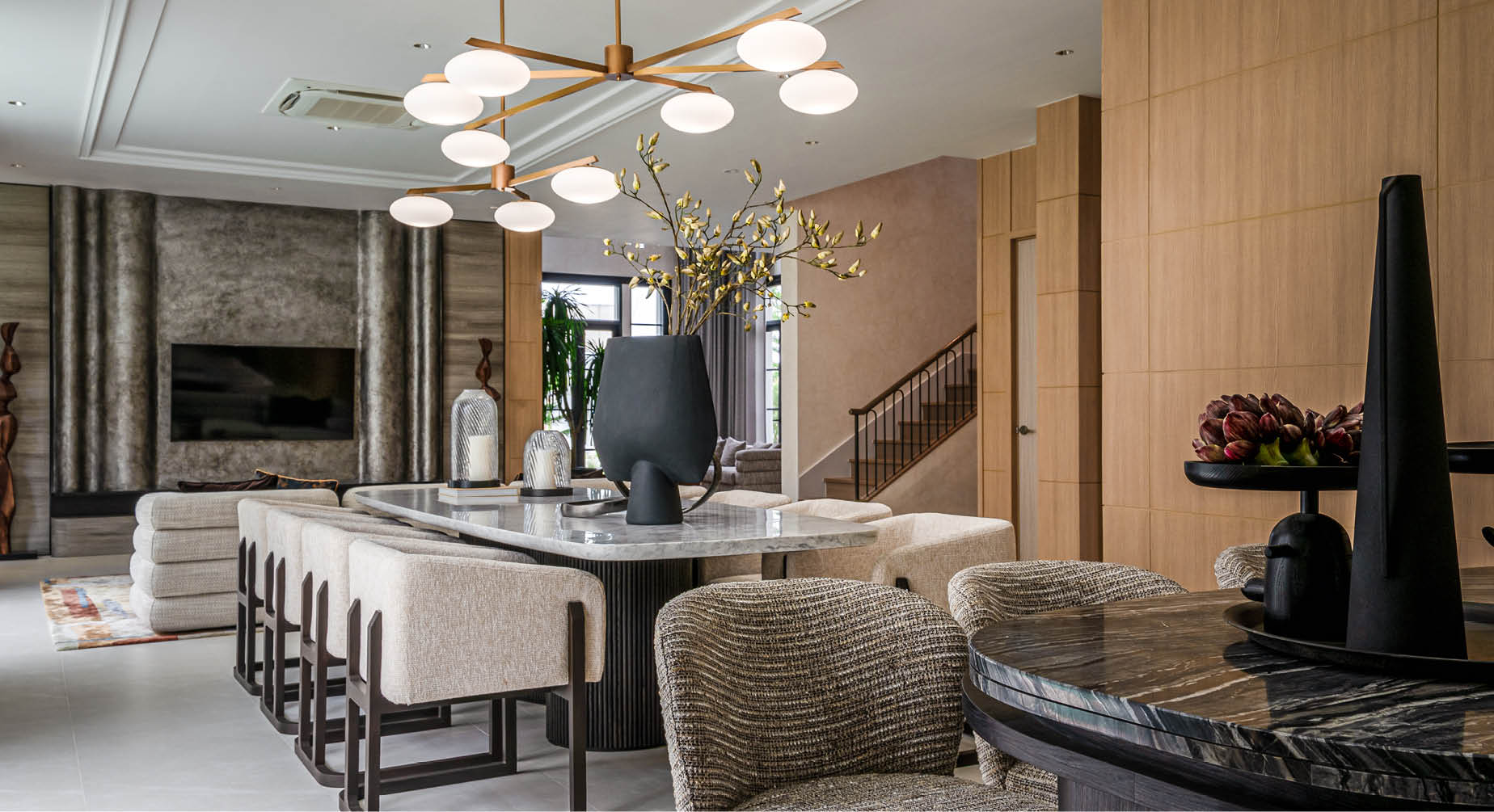 Living room on the ground floor with staircase and kitchen